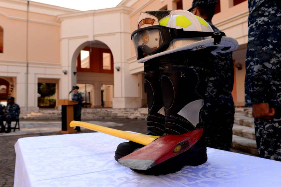 Firefighting gear is used as a memorial for the first responders during a 9-11 memorial ceremony Sept 140911-N-QY759-057