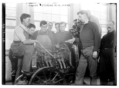 Firemen studying auto motor LCCN2014689596