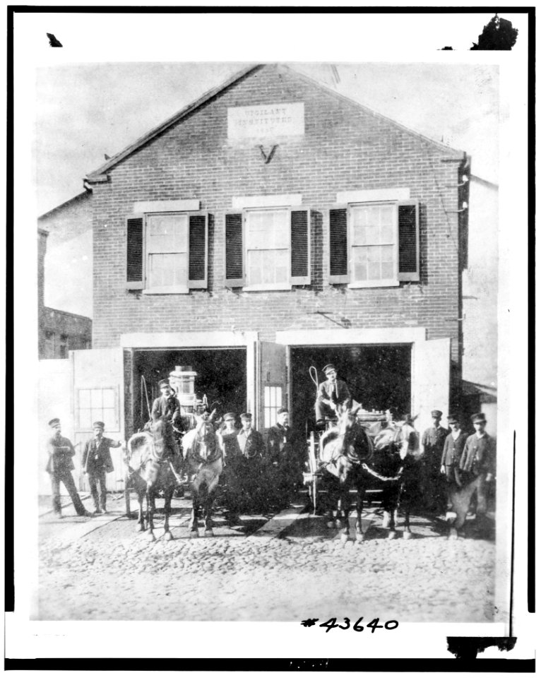 Fireman with firefighting equipment in front of the Vigilant Firehouse, 1066 Wisconsin Avenue Northwest, Washington, D.C. LCCN93510984
