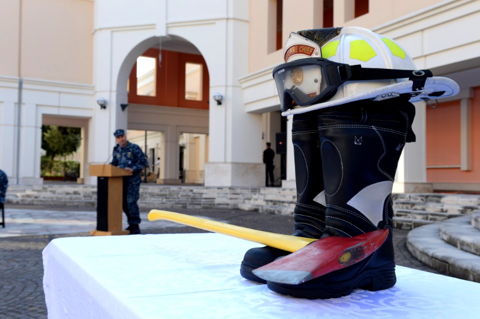 Firefighting gear is used as a memorial for the first responders during a 9-11 memorial ceremony Sept 140911-N-QY759-080