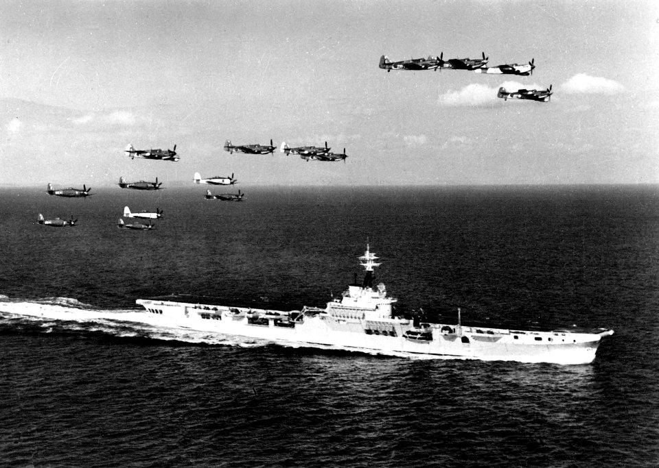 Fireflies and Sea Furies over HMAS Sydney (R17) c1949