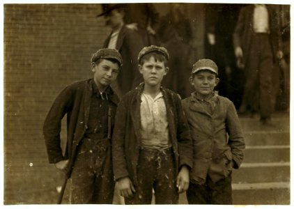 Going home from Loray Mill. Smallest boy on the right hand end, John Moore. 13 years old. Been in mill 6 years as sweeper, doffer and spinner. LOC nclc.01354