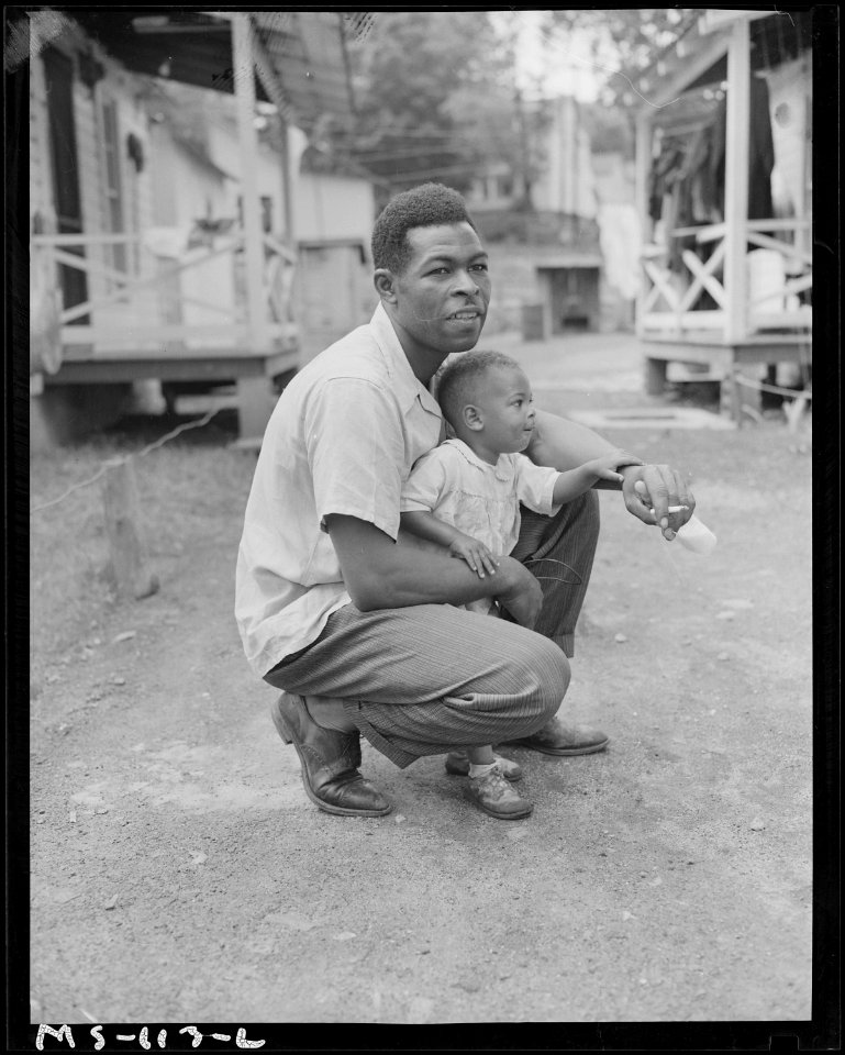 Gonzalla Sullivan, miner, with his little boy. Koppers Coal Division, Federal ^1 Mine, Grant Town, Marion County... - NARA - 540279
