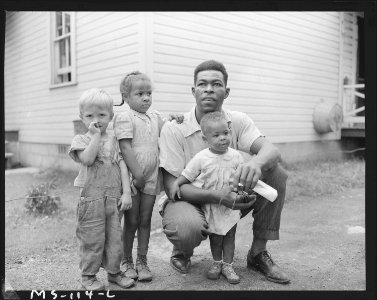 Gonzalla Sullivan, miner, with his two children and another child who lives in the neighborhood. Koppers Coal... - NARA - 540280