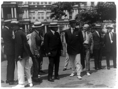 Governor Cox and Franklin D. Roosevelt surrounded by newspapermen as they arrived outside the White House for conference with Pres. Wilson LCCN96507342