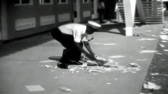 Government worker cleaning wreckage in Léopoldville