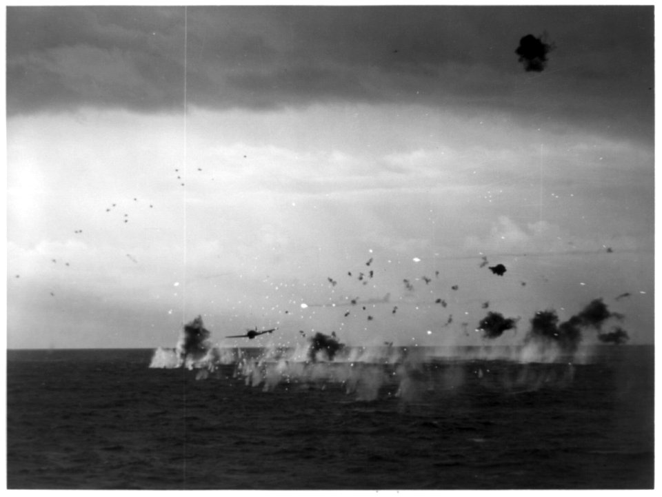 First Jap torpedo bomber, Jill, flying through hail of AA fire toward the USS Yorktown (CV-20) to attack, during the raid on Truk, Caroline Is