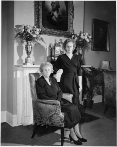 First Lady Bess Truman and her daughter, Margaret, pose for a portrait in front of the fireplace at Blair House. - NARA - 200023 photo