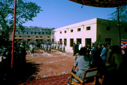 First Lady Jacqueline Kennedy watches a group of children perform a dance during her visit to Bal Sahyog photo