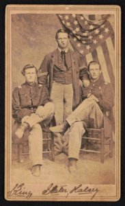 First Lieutenant Robert S. King, Second Lieutenant James W. Slater, and Captain Milton W. Halsey of 18th Ohio Infantry Regiment, in uniforms with American flag and cigars) - I.H. Bonsall, LCCN2017659644