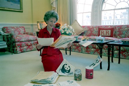First Lady Nancy Reagan reading mail for Pennies for Pandas at the White House photo