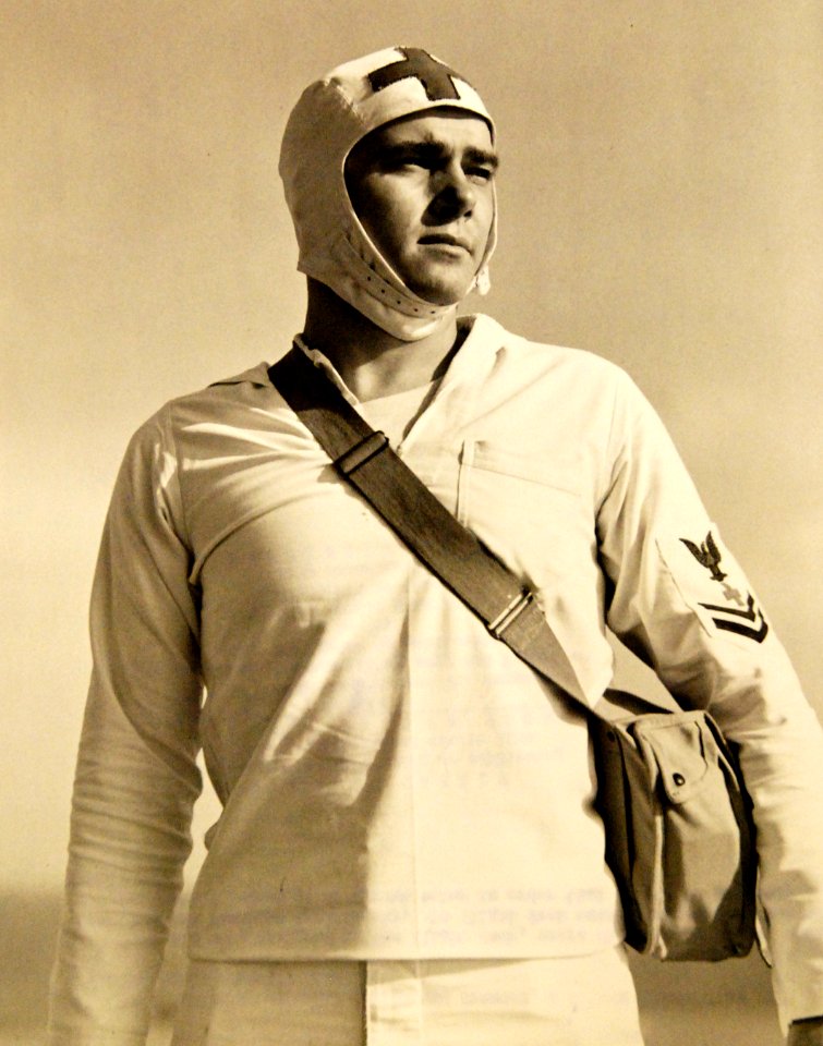 First-aid man wears distinctive helmet, assigned to the flight deck, USS Charger (ACV-30) (42447674412)