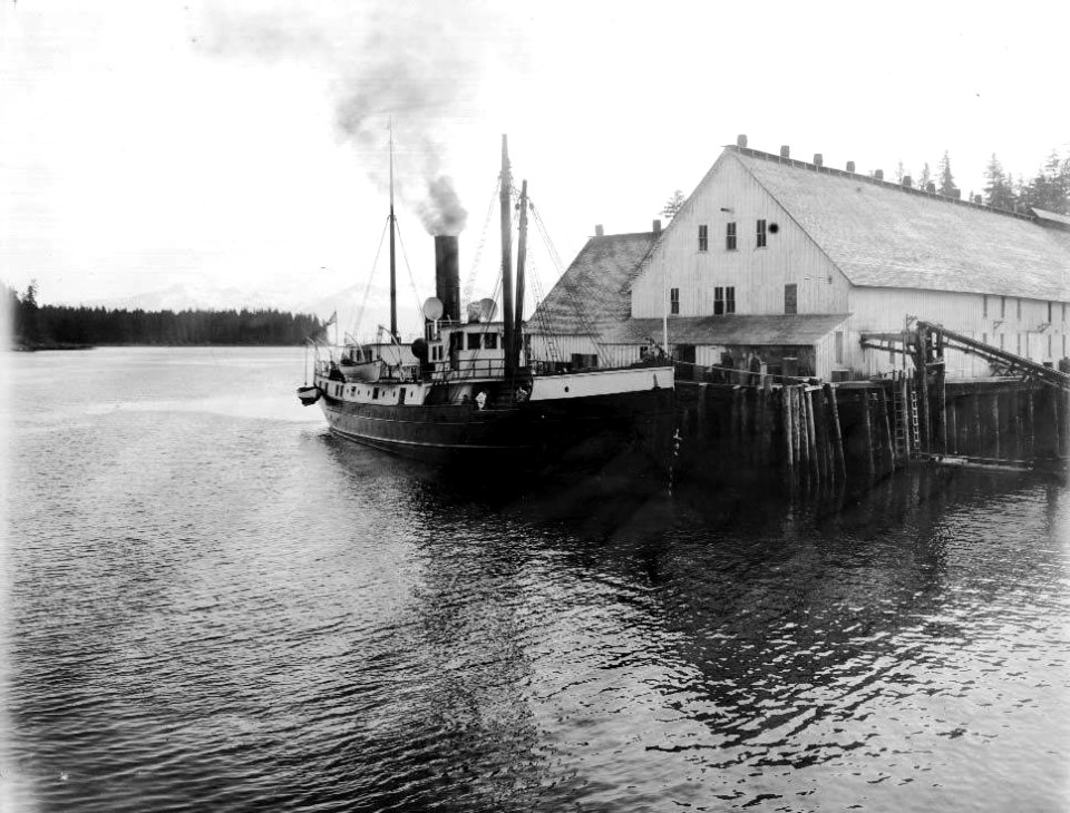 Fishing boat docked at the cannery of the Pacific Coast and Norway Packing Co, Petersburg, Petersburg, ca 1914 (CURTIS 1931)