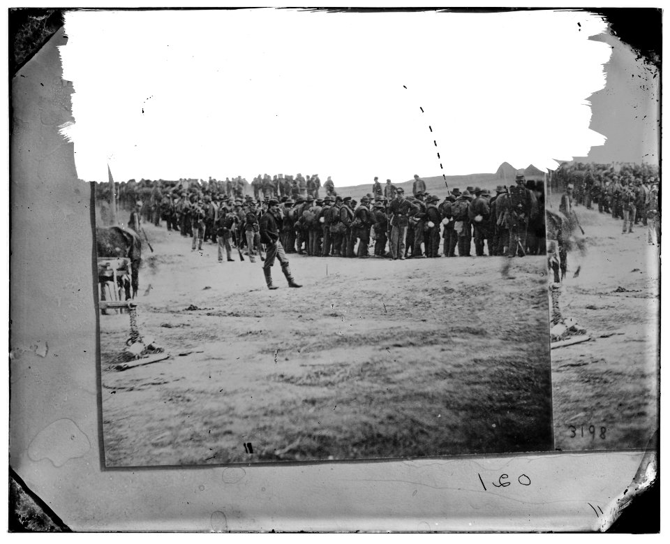 Five Forks, Virginia (vicinity).) Confederate prisoners on the way to the rear. Captured at Five Forks LOC cwpb.02581