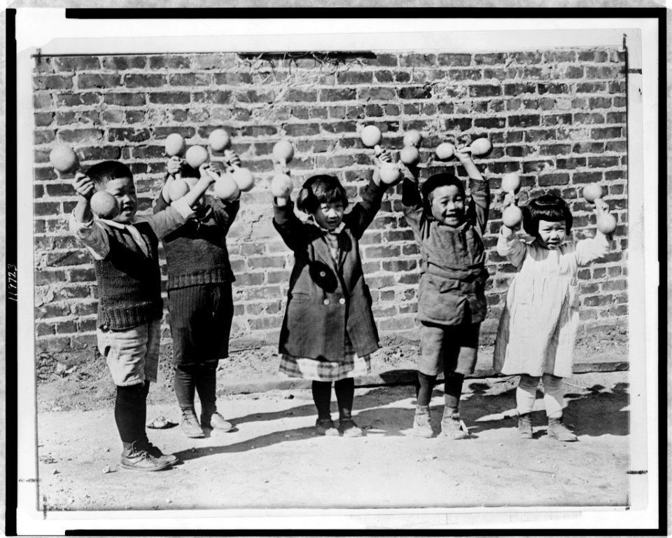 Five Asian children holding up small barbells LCCN98506830