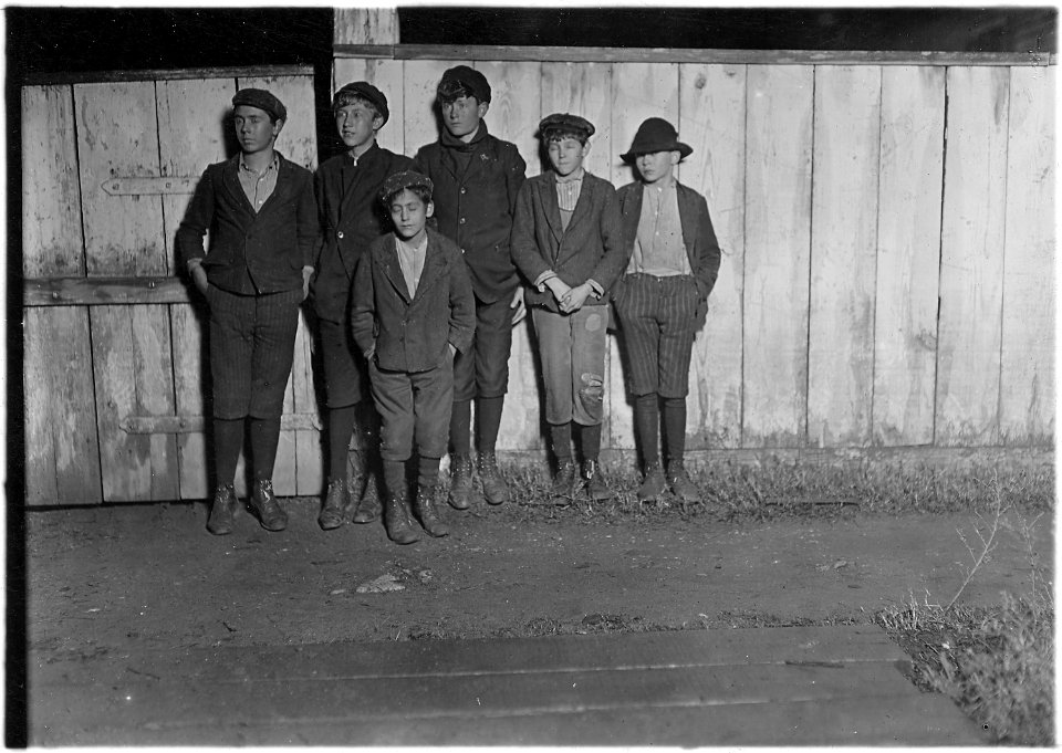 Flashlight photo 6 P.M. going home from King Mfg. Co. Two of the smallest boys been in mill 2 years. One of the... - NARA - 523150