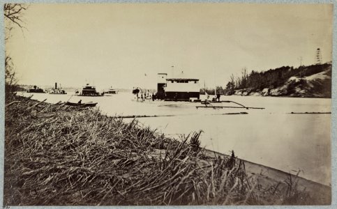 Fleet of monitors in Trent's Reach, James River, Va. Butler's Crow's Nest signal tower on bank of river LCCN2013647354