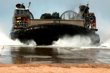 Flickr - Official U.S. Navy Imagery - A landing craft air cushion approaches a beach after departing the well deck of USS New Orleans.
