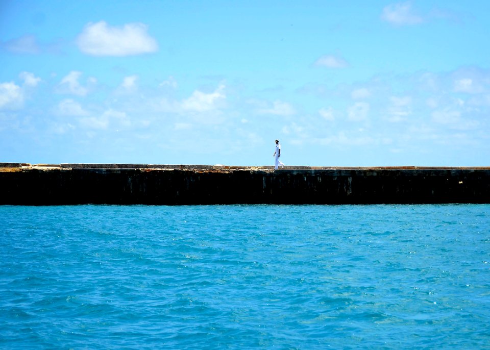 Flickr - Official U.S. Navy Imagery - A lone Sailor walks back down a pier following a ceremony commemorating the 70th anniversary of the Battle of Midway.