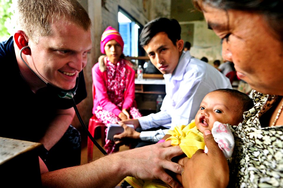 Flickr - Official U.S. Navy Imagery - A Navy officer listens to the heart of a Cambodian girl.