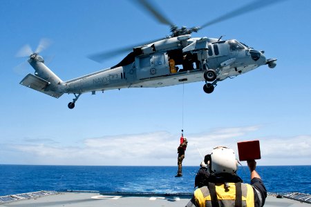 Flickr - Official U.S. Navy Imagery - A New Zealand officer is winched down.