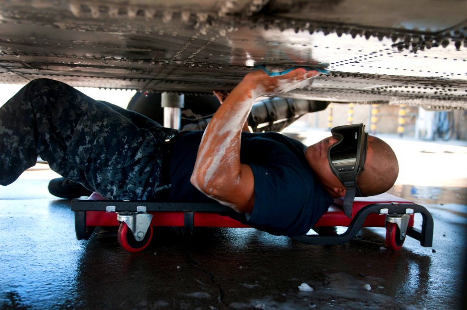 Flickr - Official U.S. Navy Imagery - A Sailor cleans a helicopter.