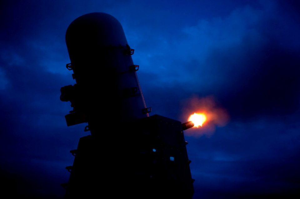Flickr - Official U.S. Navy Imagery - A CIWS mount fires at night.