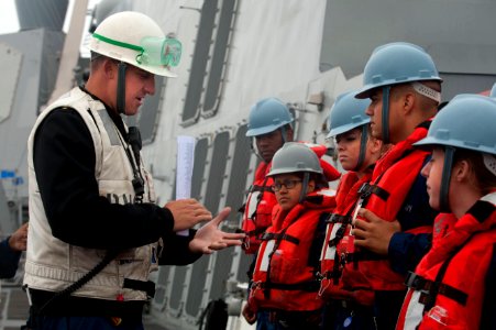 Flickr - Official U.S. Navy Imagery - A Chief gives Sailors a safety brief before an underway replenishment.