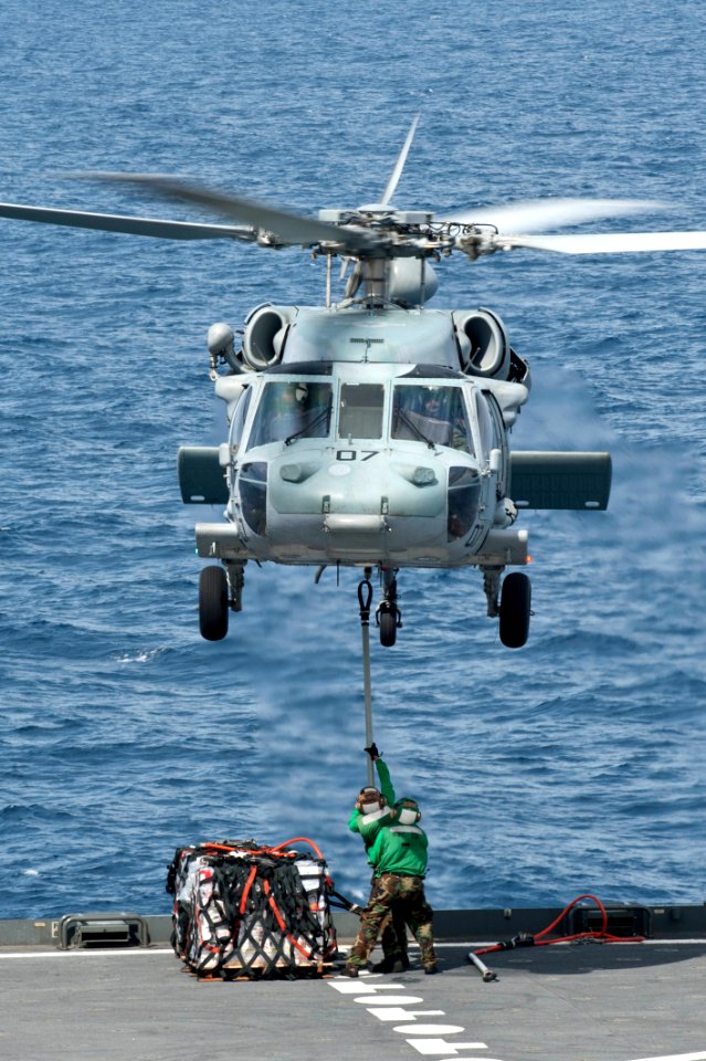 Flickr - Official U.S. Navy Imagery - A helicopter lifts supplies from the fantail