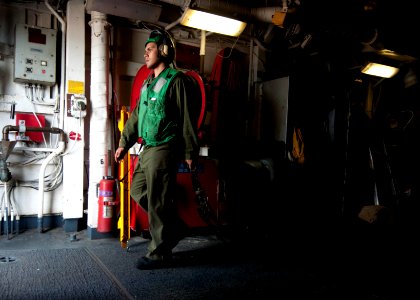 Flickr - Official U.S. Navy Imagery - A Sailor drags chains to the flight deck.