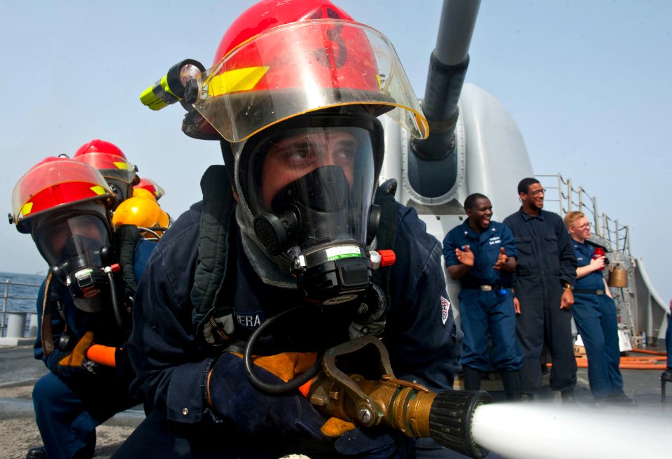 Flickr - Official U.S. Navy Imagery - A hose team sprays water at a target during a damage control Olympics.