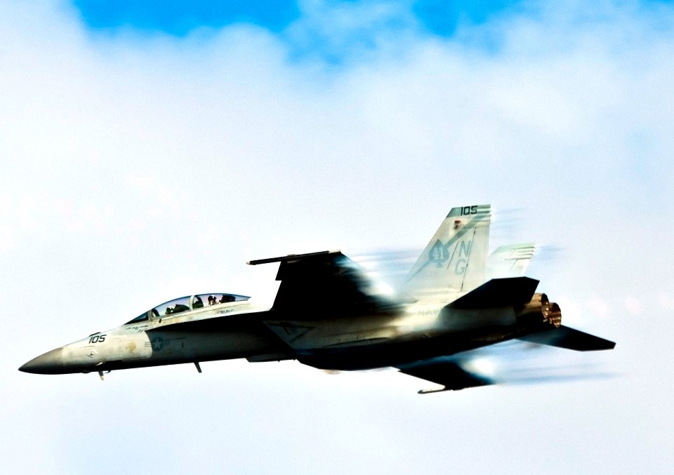 Flickr - Official U.S. Navy Imagery - A jet breaks the sound barrier during an air power demonstration for participants of a tiger cruise.