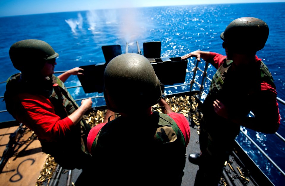Flickr - Official U.S. Navy Imagery - A Sailor fires a machine gun. (3)