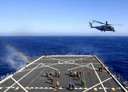 Flickr - Official U.S. Navy Imagery - A helicopter launches from the deck.