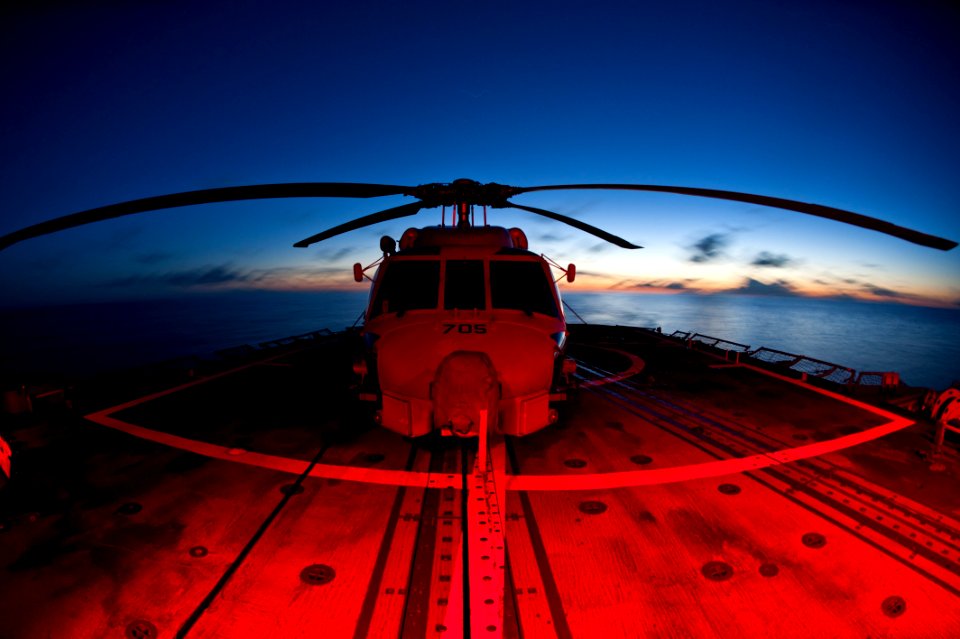 Flickr - Official U.S. Navy Imagery - A helicopter sits chocked and chained on the flight deck.