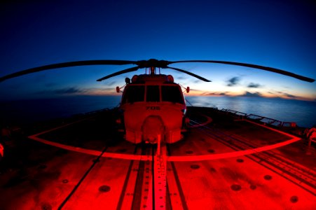 Flickr - Official U.S. Navy Imagery - A helicopter sits chocked and chained on the flight deck.