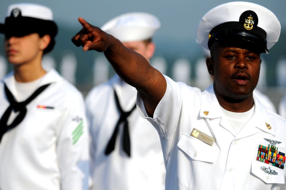 Flickr - Official U.S. Navy Imagery - A Navy Chief directs Sailors in preparation to man the rails