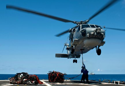 Flickr - Official U.S. Navy Imagery - A Sailor loads cargo.
