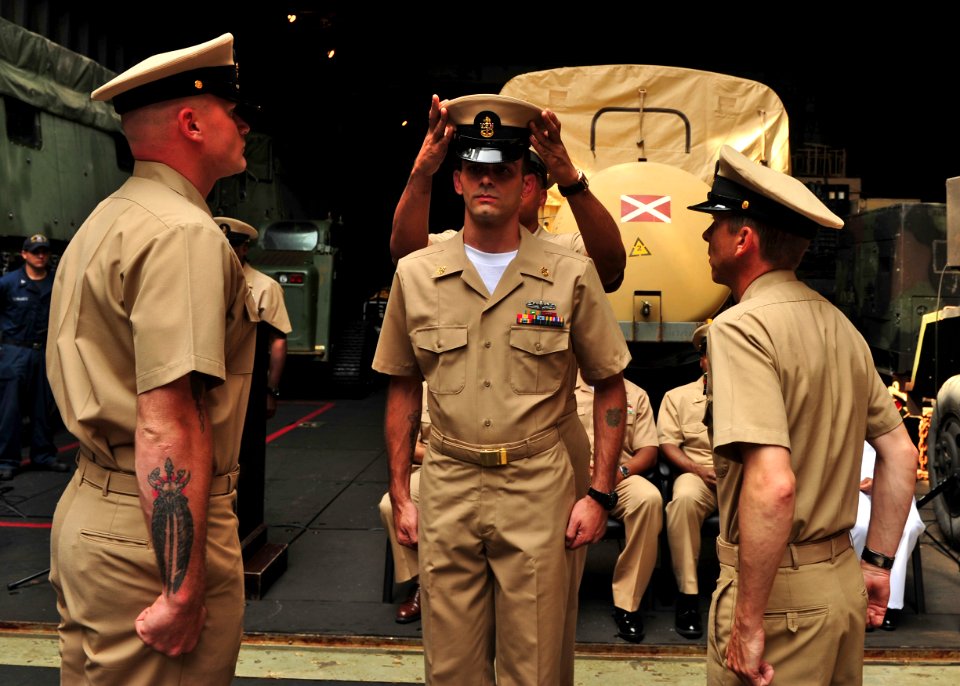 Flickr - Official U.S. Navy Imagery - A new chief receives his combination cover. (3)