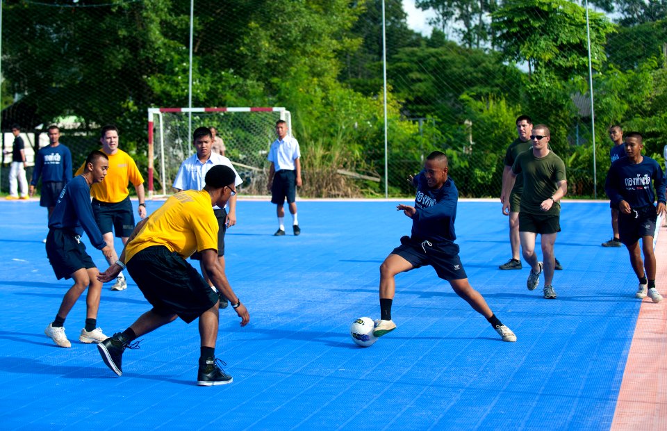 Flickr - Official U.S. Navy Imagery - A Royal Thai Navy sailor maneuvers around a Sailor during a soccer match.