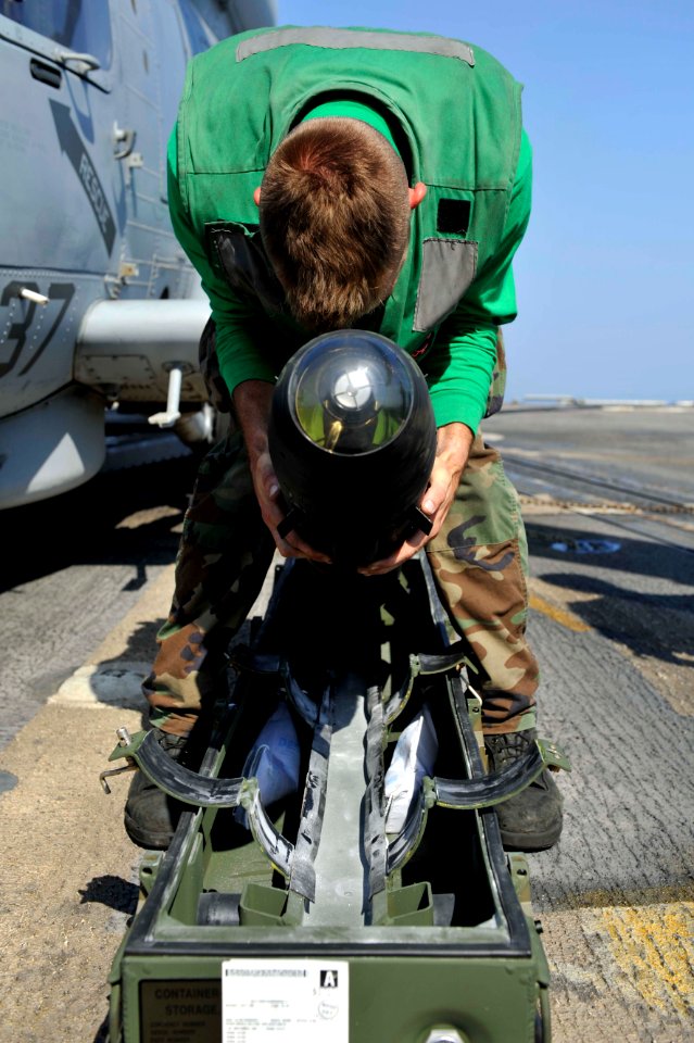 Flickr - Official U.S. Navy Imagery - A Sailor puts away a Hellfire missile.