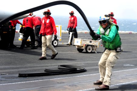 Flickr - Official U.S. Navy Imagery - A Sailor removes the catapult protector.