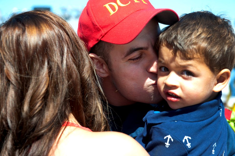 Flickr - Official U.S. Navy Imagery - A Sailor reunites with his family after returning.