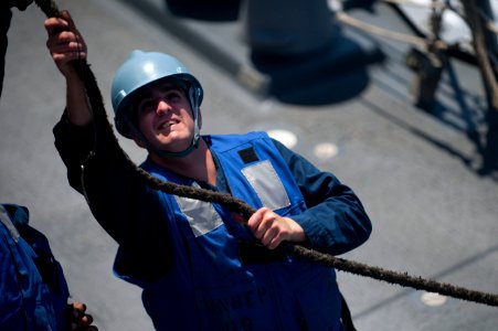 Flickr - Official U.S. Navy Imagery - A Sailor secures line to the trolley during an underway replenishment.