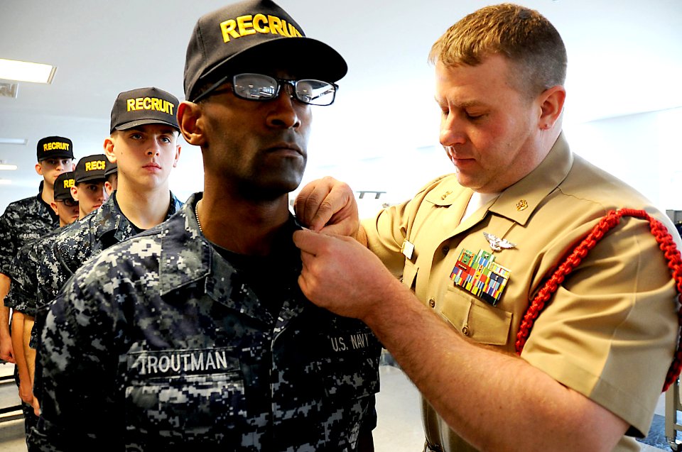 Flickr - Official U.S. Navy Imagery - A recruit division commander inspects the uniform of a recruit at Recruit Training Command.
