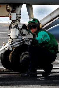 Flickr - Official U.S. Navy Imagery - A Sailor signals ready to launch.