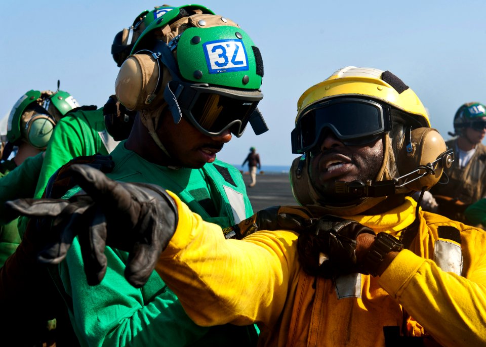 Flickr - Official U.S. Navy Imagery - A Sailor directs fire fighters during a drill.