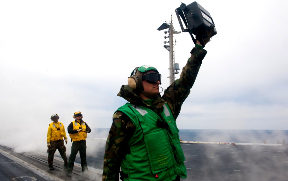 Flickr - Official U.S. Navy Imagery - A Sailor confirms the weight of a fixed wing aircraft.