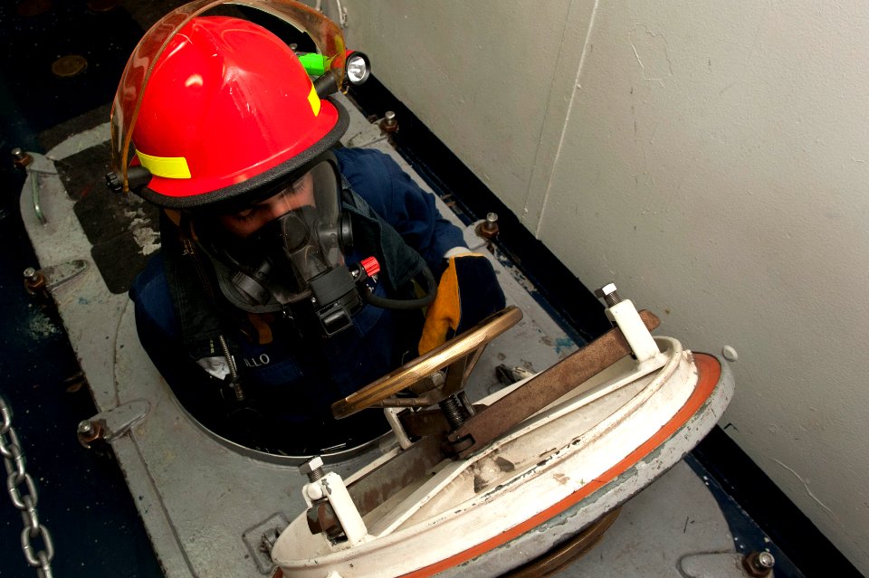 Flickr - Official U.S. Navy Imagery - A Sailor enters a space during a toxic gas damage control drill.