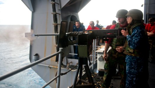 Flickr - Official U.S. Navy Imagery - A Sailor fires a machine gun. (2) photo
